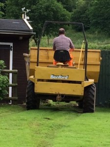 Extremely large dumper takes soil to the field