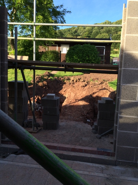 View from kitchen through patio door to steps