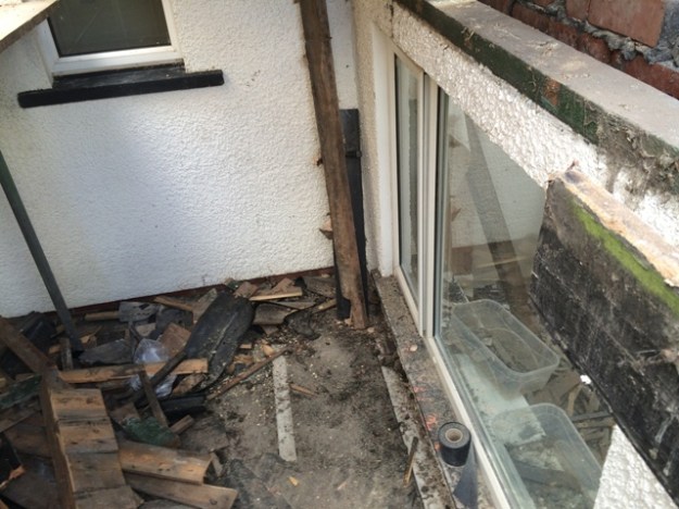 area-which-will-be-walk-way-into-new-kitchen-from-back-door-beside-old-bedroom-note-large-difference-in-floor-height-steps-will-be-needed