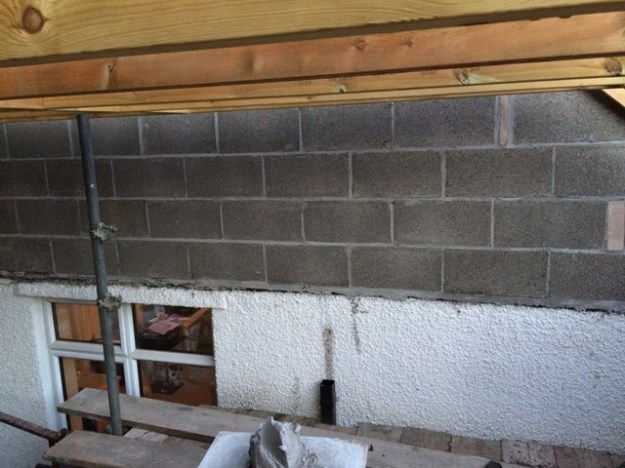 block-wall-going-up-between-bedroom-and-new-kitchen-from-scaffolding-window-to-be-filled-in-next-week