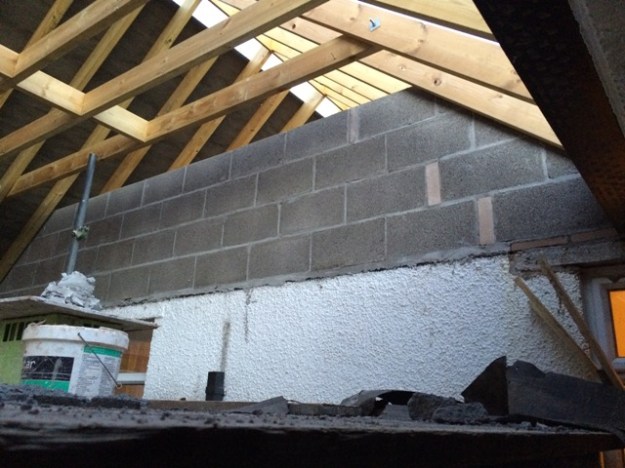 block-wall-going-up-between-bedroom-and-new-kitchen