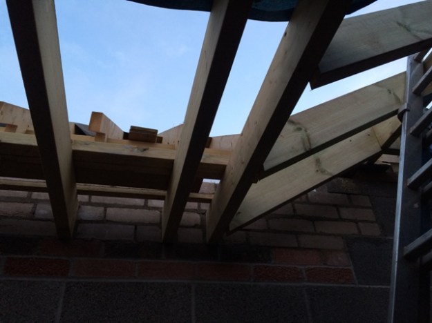 close-up-of-new-sloping-beams-to-accomodate-head-height-for-steps-which-have-yet-to-be-built-to-reach-new-level-of-kitchen