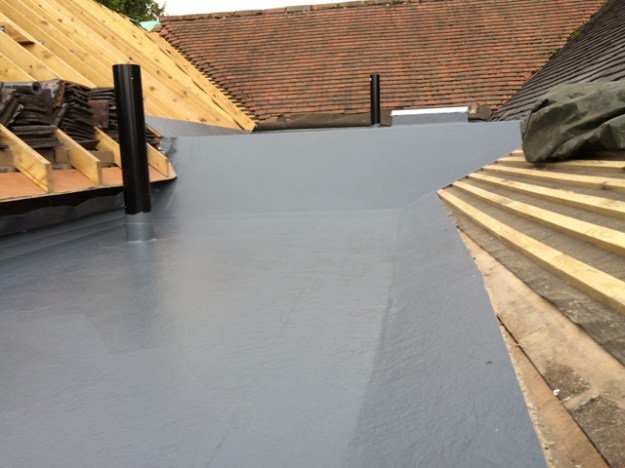 fibre-glass-roof-shows-sloping-sections-and-new-skylight-and-vents-all-put-in-place-today