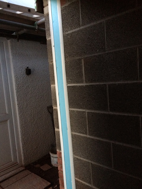 installation-of-plastic-and-foam-lining-to-seal-cavity-around-door