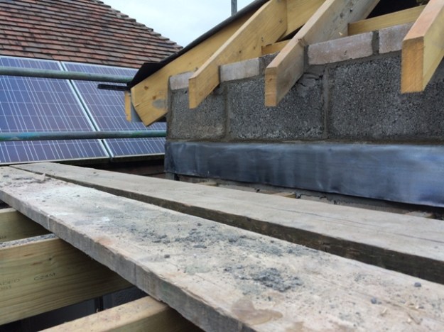 lead-inserted-into-roof-and-wall-finished