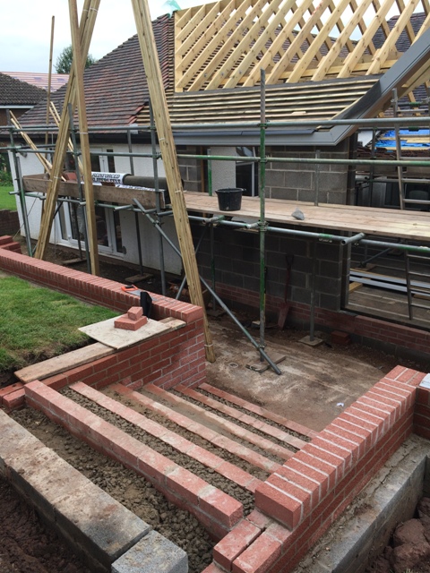 main-steps-filled-with-concrete-and-view-up-to-roof-where-felt-and-batoning-has-begun