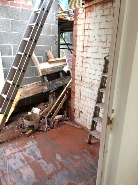 rubble-and-plaster-board-from-utility-wall-also-see-vertical-cuts-in-wall-which-will-be-the-door-opening-into-the-new-bathroom