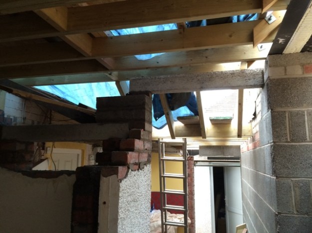 sloping-roof-created-to-accomodate-enough-head-height-when-going-down-steps-from-new-kitchen-to-utility