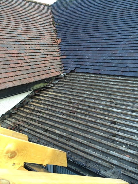 Tiles removed from roof over small bedroom, this will be a new bathroom, picture taken from scaffolding
