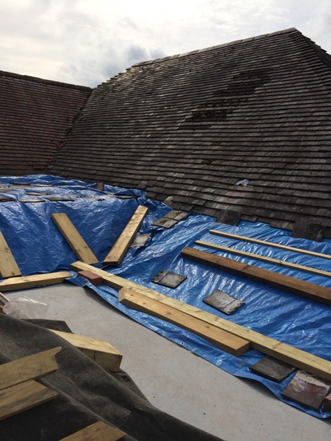 view-from-scaffolding-of-tarpaulins-new-bathroom-and-utility-room-sloping-roof-can-be-seen-under-tarpaulin