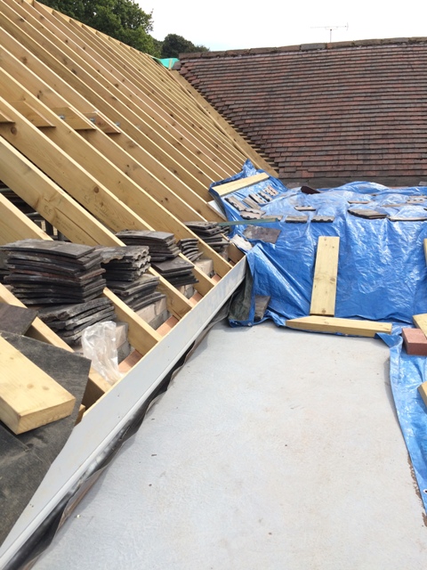 view-from-scaffolding-of-tarpaulins-over-part-of-new-bathroom-and-utility-room-lefthand-side-of-roof