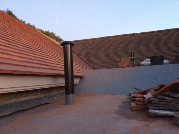 different-view-of-flat-roof-and-tiling-nearly-complete