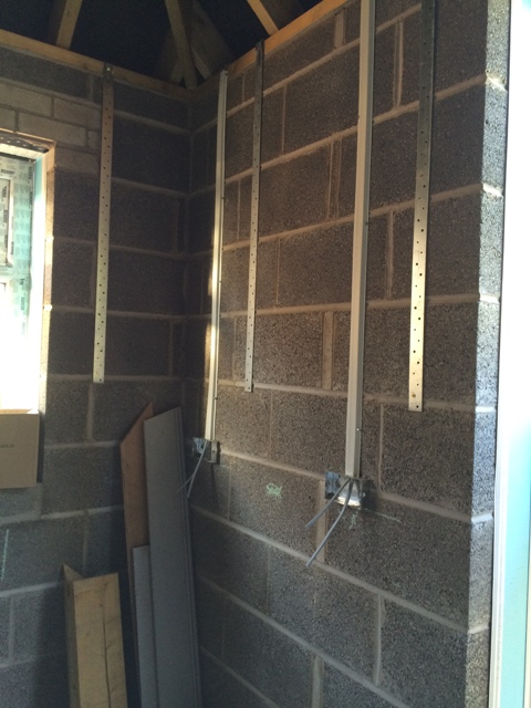 electricians-work-so-far-installing-electricity-and-plug-sockets-in-new-kitchen