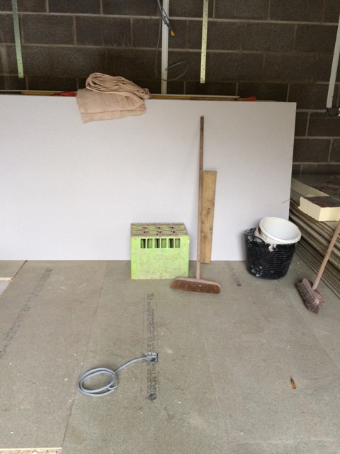 kitchen-with-insulation-partly-complete-and-flooring-also-shows-electrical-plug-socket-in-floor-for-island-unit