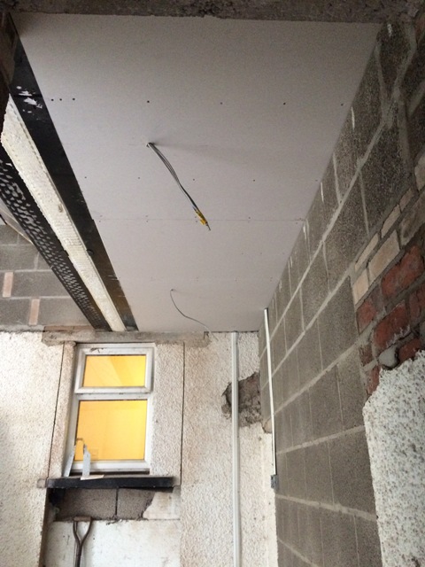 new-plasterboard-ceiling-in-entrance-to-kitchen-beneath-flat-roof