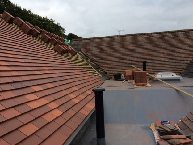 roof-tiling-progress-adjacent-to-flat-roof-picture-2