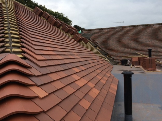 roof-tiling-progress-adjacent-to-flat-roof