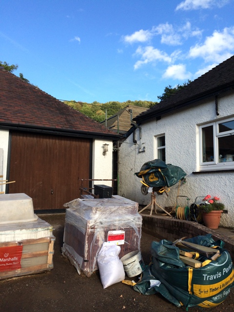 top-of-drive-in-front-of-double-garage-with-materials-and-new-roof-structure-with-felt-and-battening-between-house-and-garage