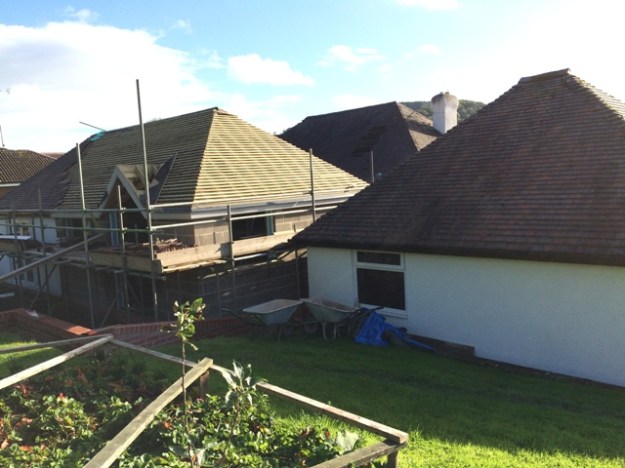 view-of-back-of-house-showing-valley-in-the-middle-between-the-two-roofs