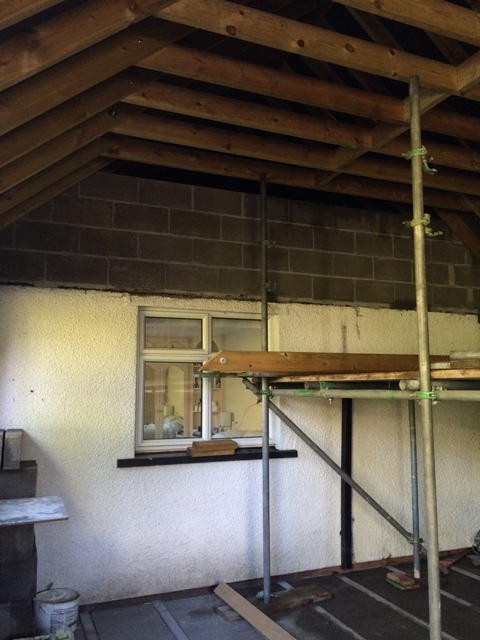 view-of-main-bedroom-through-window-to-be-blocked-up-scaffolding-still-in-place-inside