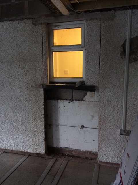 wall-partly-cut-in-readiness-for-new-door-to-kitchen-from-hallway