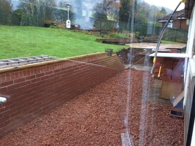 chippings-used-right-along-the-back-of-the-house-in-preparation-for-new-slabs-being-laid