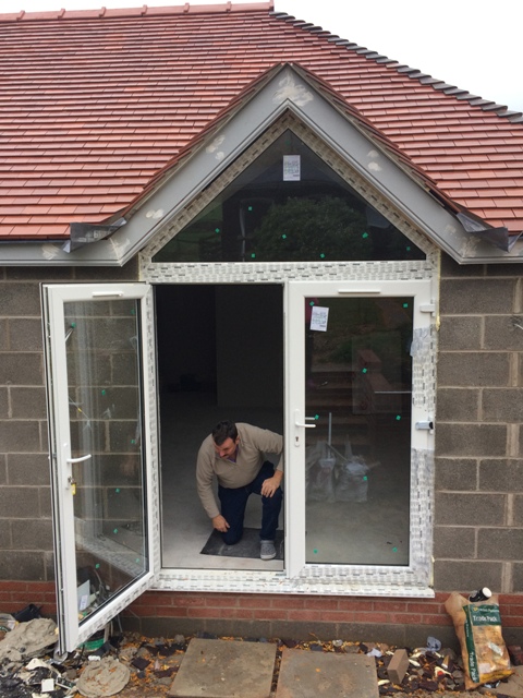new-patio-doors-with-triangular-window-fitted-above