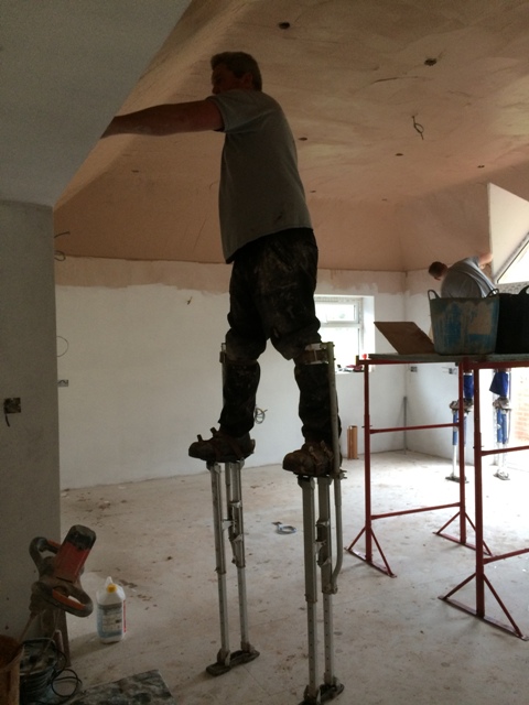 plasterers-at-work-on-stilts-2