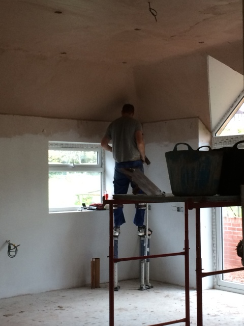 plasterers-at-work-on-stilts-3