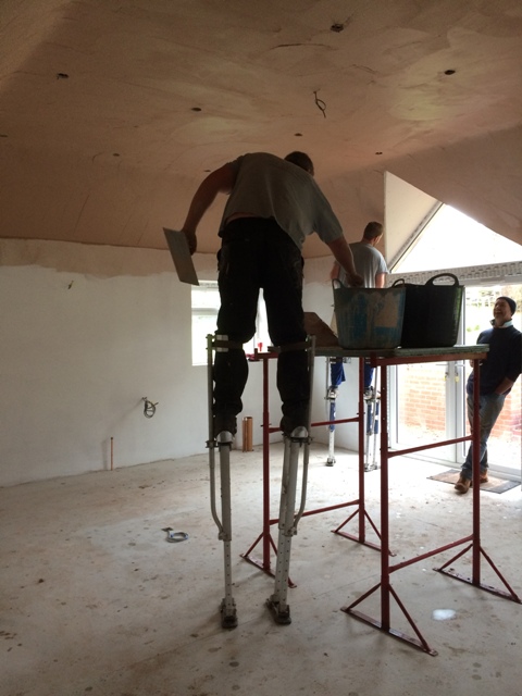 plasterers-at-work-on-stilts