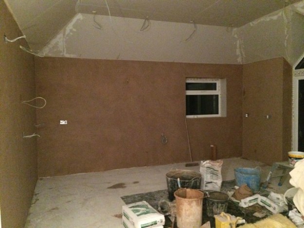plastering-along-wall-adjacent-to-garage