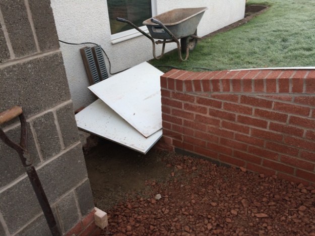 steps-beside-side-kitchen-window-base-prepared-and-protected-from-frost