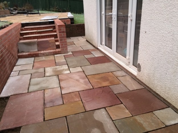 slabs-cut-for-patio-indian-sandstone-all-vary-in-colou-creating-a-patterned-effect