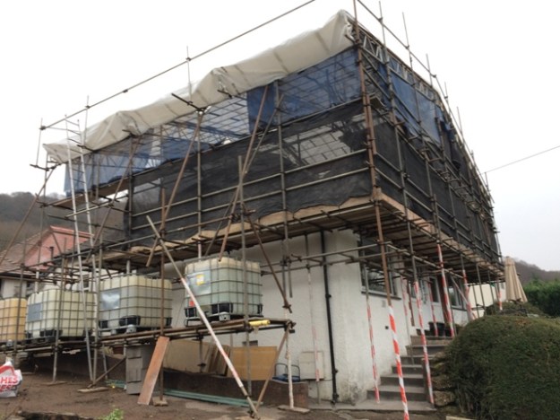 canopy-completed-showing-left-side-of-house-and-the-water-containers-which-hold-scaffolding-in-place