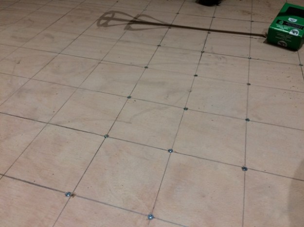 grid-pattern-marked-out-on-wood-flooring