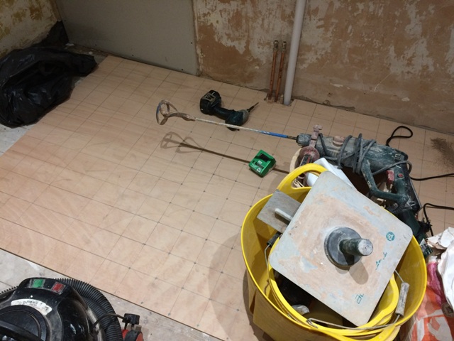new-bathroom-wood-screwed-down-in-a-grid-pattern-to-ensure-tiles-will-be-laid-on-a-solid-base