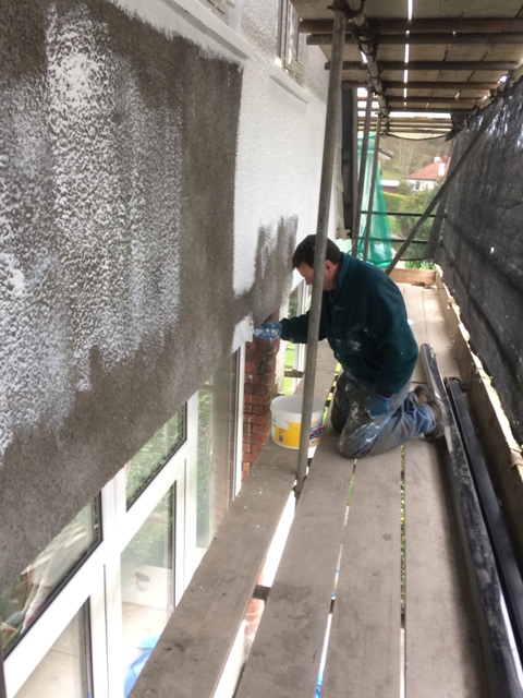 First coat of masonery paint on new rendering