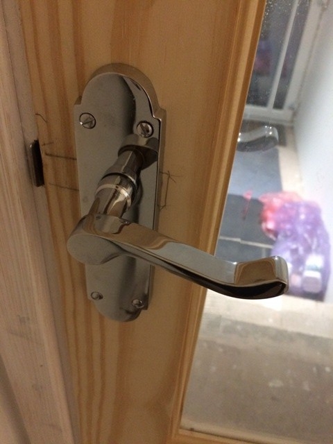 Handles to door to utility and new family bathroom fitted by Tony