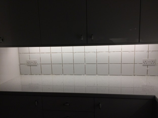 Tiles above cooker before being grouted