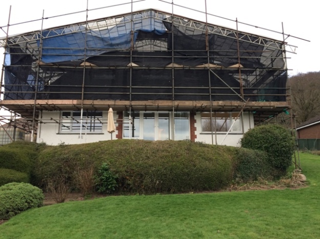 View of the house with new front doors and windows