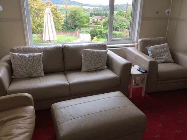new sofabed in small sitting room and matching chair